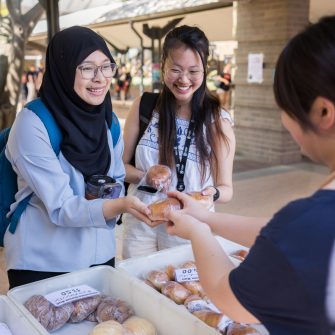 Two students buying food