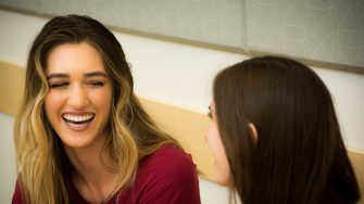 Two women chatting and smiling