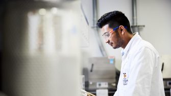 UNSW engineering student wearing safety gear in workshop