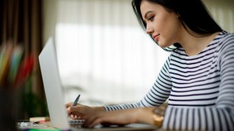 Young woman working at home