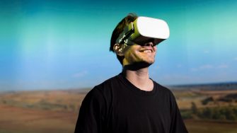 Man with Virtual Reality headset on head