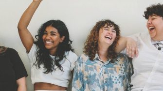 Group of people sitting and laughing