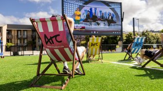 Students using UNSW's Village Green