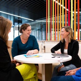 UNSW HR staff sitting around a desk