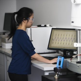 Woman working at computer in lab