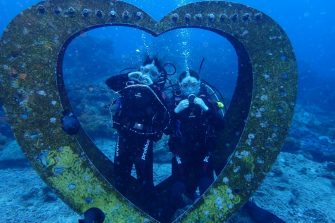 two students scuba diving