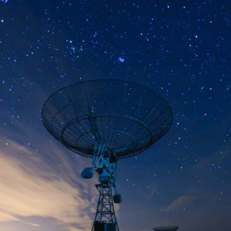 satellite dish under a starry sky