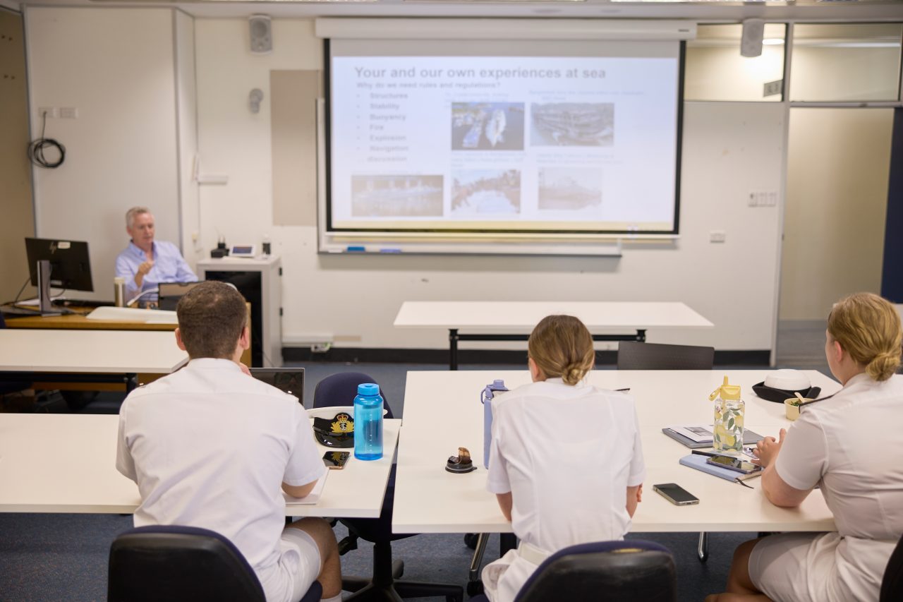 ADFA Canberra UNSW students looking at classroom screen with lecturer