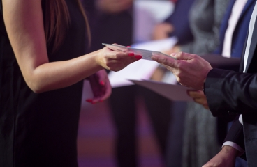 Student receiving a certificate at an award ceremony