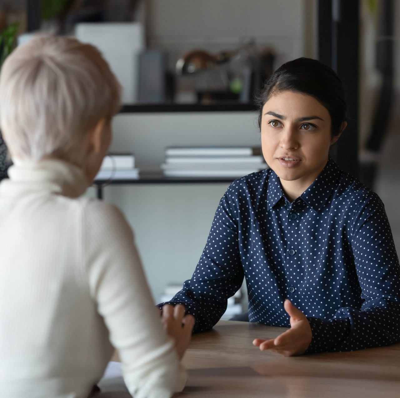 Photo of two people having a serious conversation