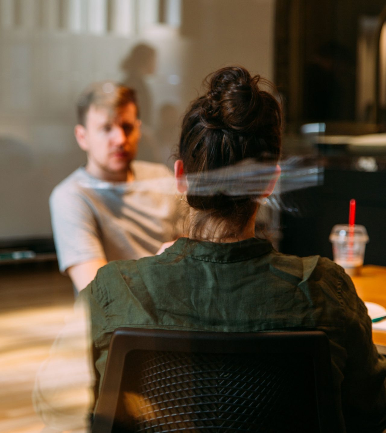 Photo of two workers in a discussion at the office